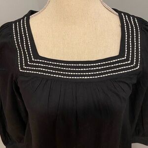 Elegant Black Women's Top with White Trim
